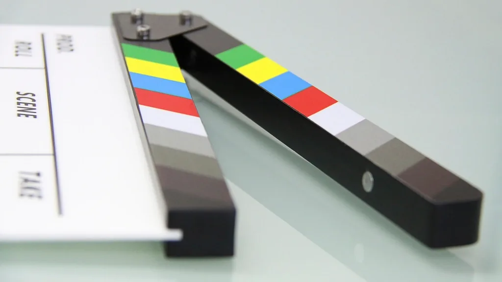 Film clapperboard resting on a table